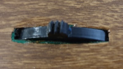 Not a great picture, but you can see the green underneath the vinyl cladding.