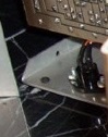 woodgrain cladding closeup off the RC Hall of Fame - front case. Note the silver case underneath the vinyl