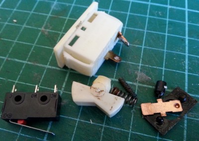 original switch with internals removed &amp; the replacement micro-switch alongside for comparison. Most surgery was on the rocker which had to be completely hollowed out and a rebate made in one end to fit over the lever of the micro-switch