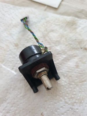 the original stick pot on its mount, which screwed to the PCB then front bezel