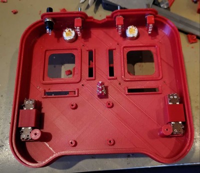 First position your switches and connect them, it's quite tight so you have to be carefull and thest with the sticks in position