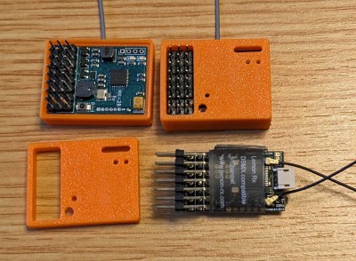 Tobe's latest nRF24L01+ Rx with onboard sounder, next to a LemonRx Rx for size comparison