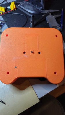 The back with the battery hatch and the compartment for the RF-module