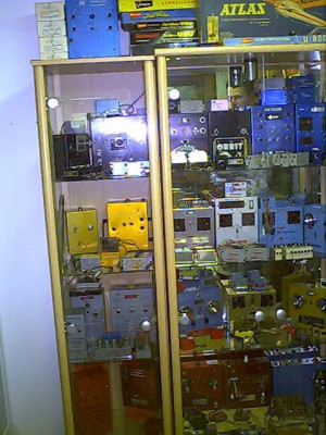 a cabinet of radios