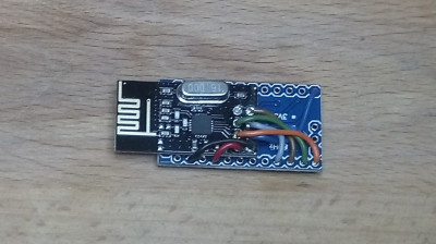 NRF24 mounted with 2 layers of DST on the back of the ProMini. <br />Aerial overhangs a few mm to avoid masking